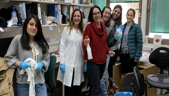 Group photo cleaning the lab